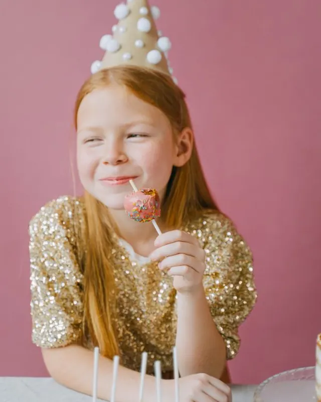 Girl in a gold sequin top at a party